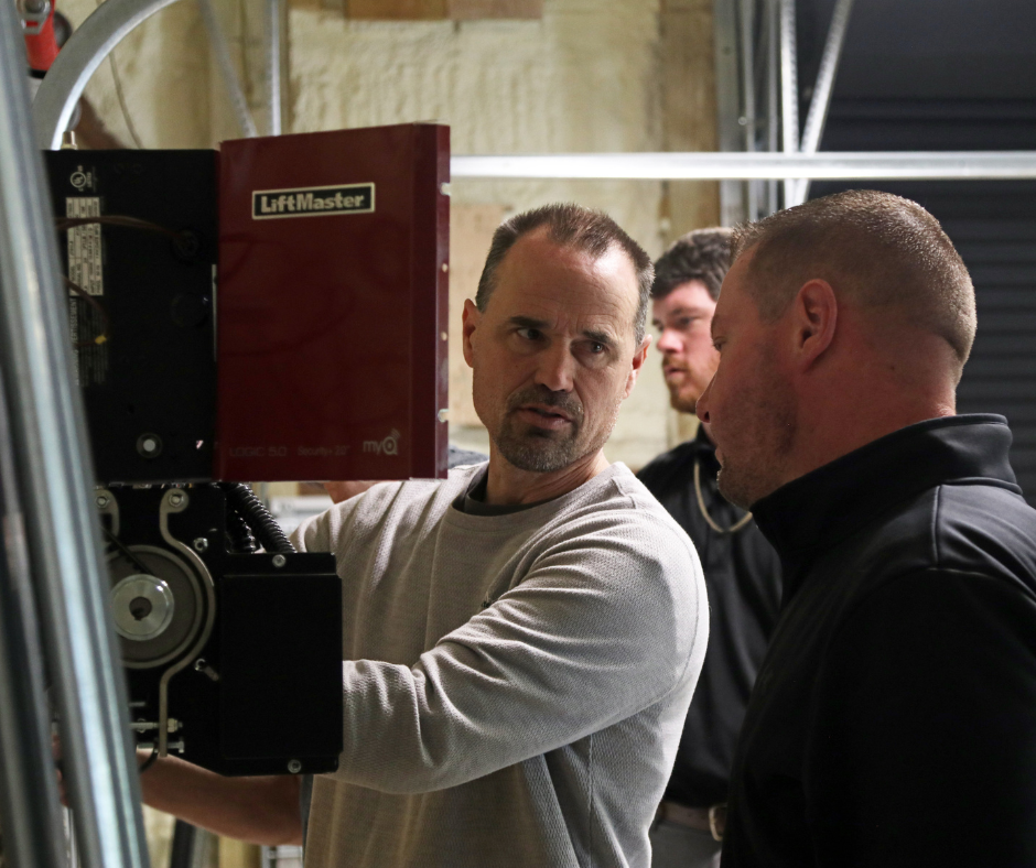 Dave Mount showing students the liftmaster commercial motor