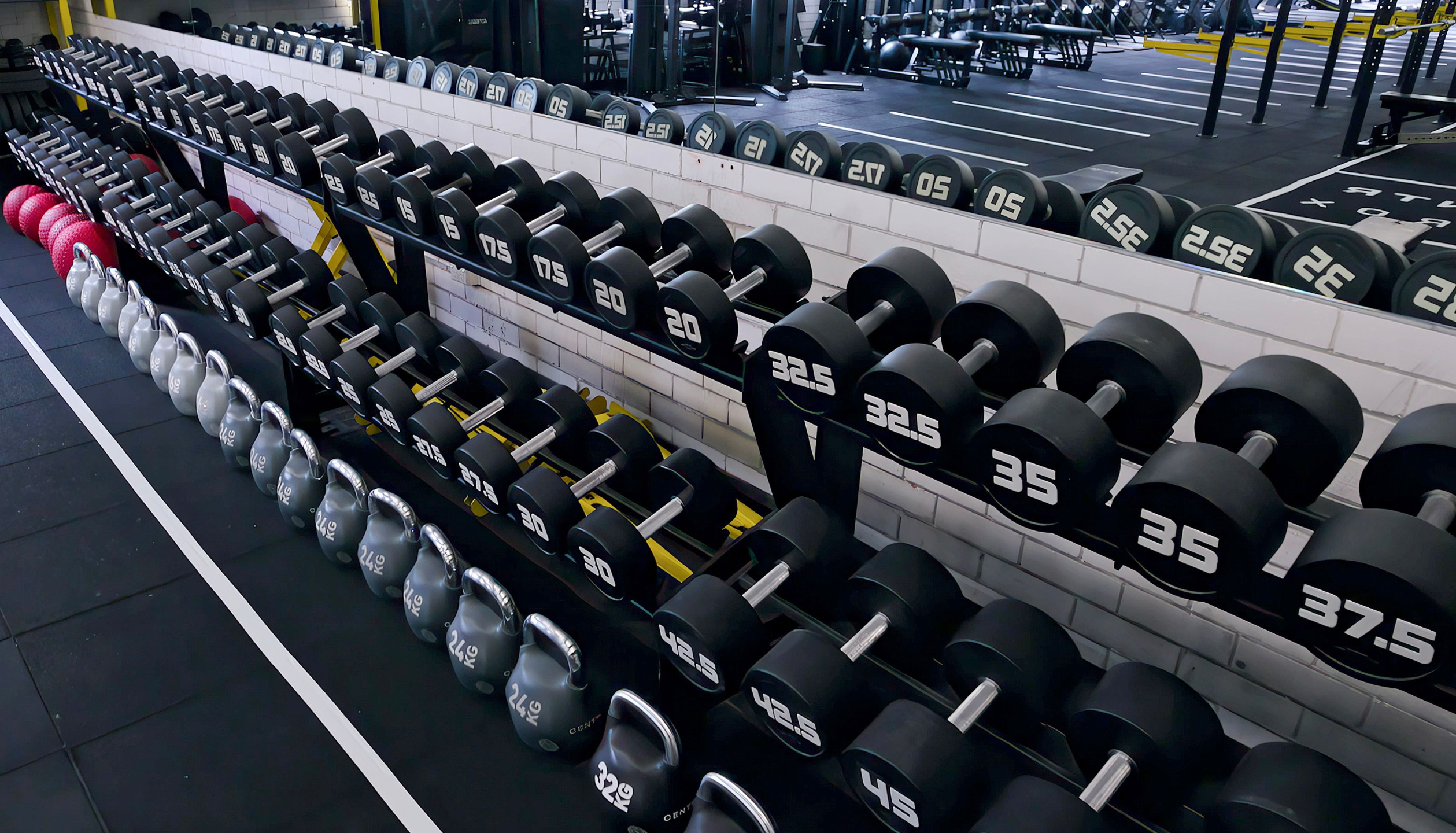 HYROX athlete performing dumbbell strength training to build power and muscular endurance at Soultrain gym Sydney