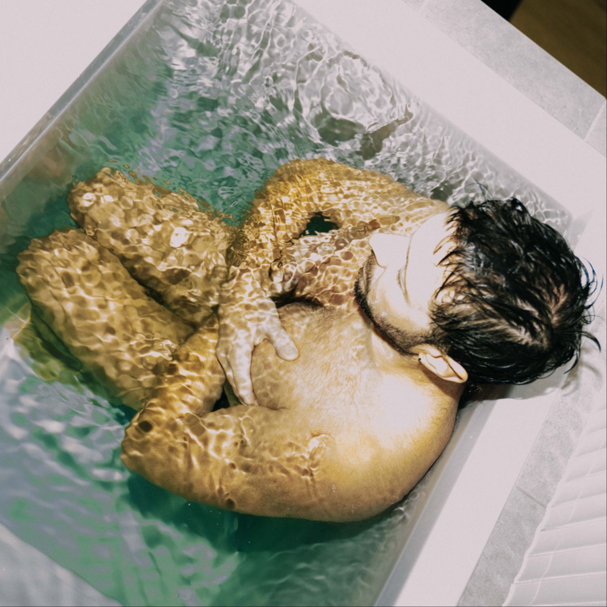 Group meditating indoors as part of recovery session including breathwork and visualization
