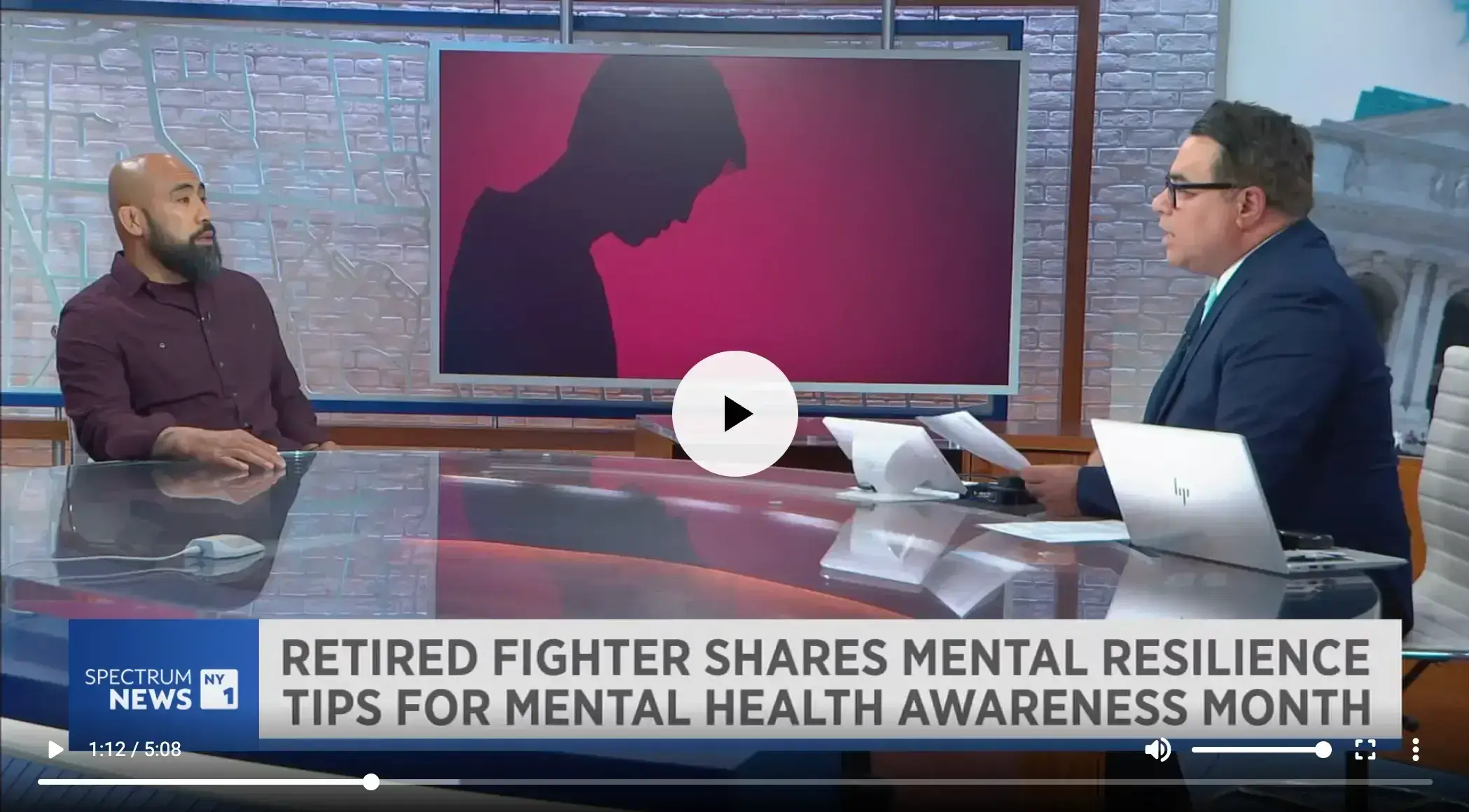 Chris Romulo on a televised news interview discussing mental resilience tips for Mental Health Awareness Month