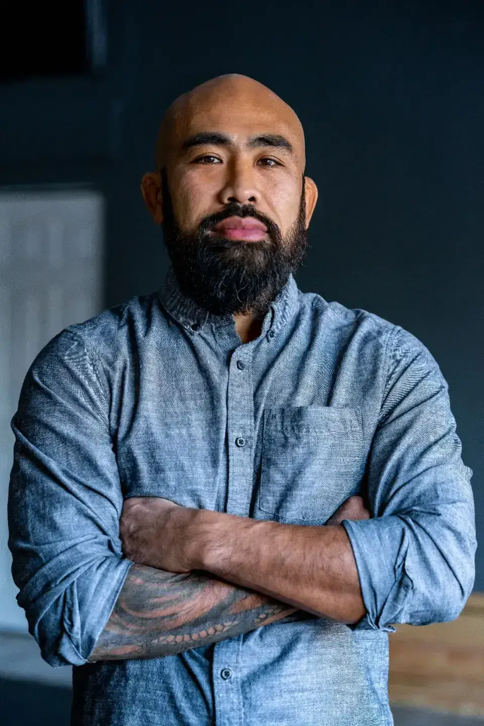 Chris Romulo standing with arms crossed, available for keynotes and workshops