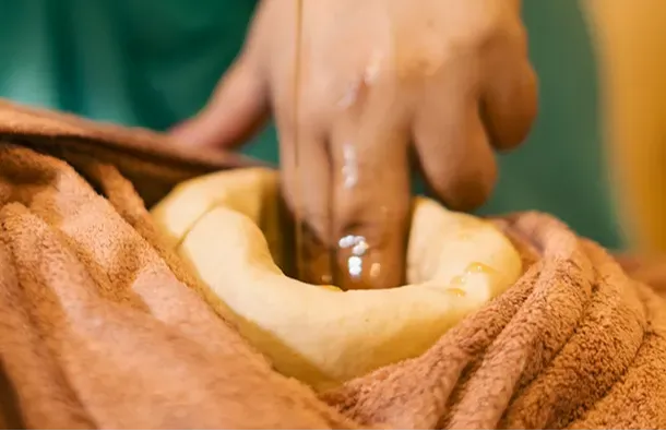 Bahya Vasti (External Dough Dam) Oil Soaking Therapy by Ayuskama Ayurveda