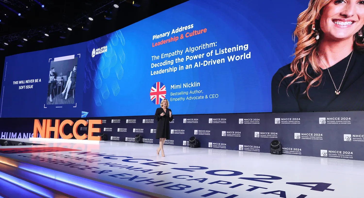 Mimi speaking at conference