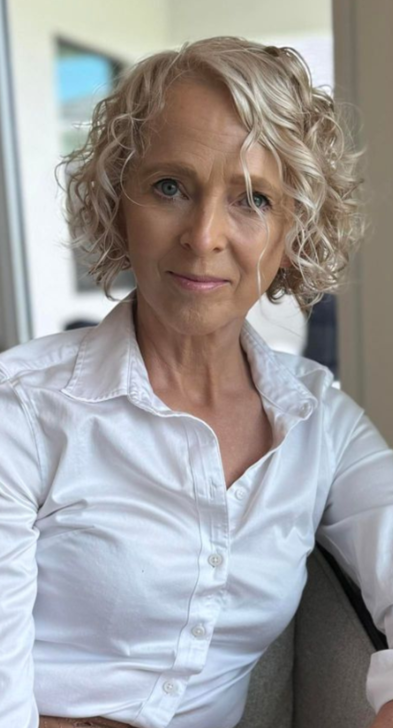 Debbie Roppo demonstrating wellness practices, guiding women over 50 to achieve vitality and age gracefully through holistic health coaching.