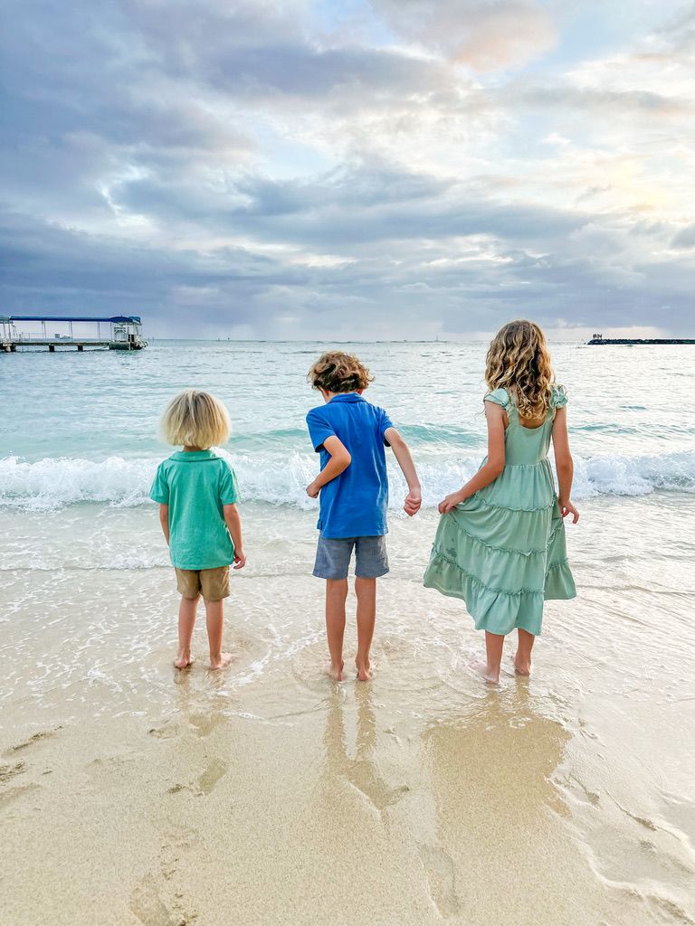 Woman in organized clean coastal kitchen in San Diego, CA.