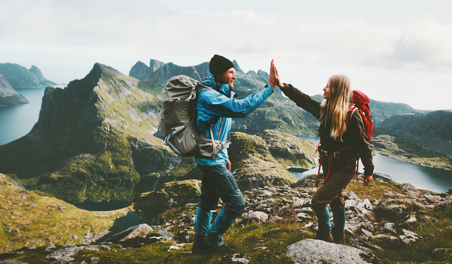 Two guides high-fiving during guide training