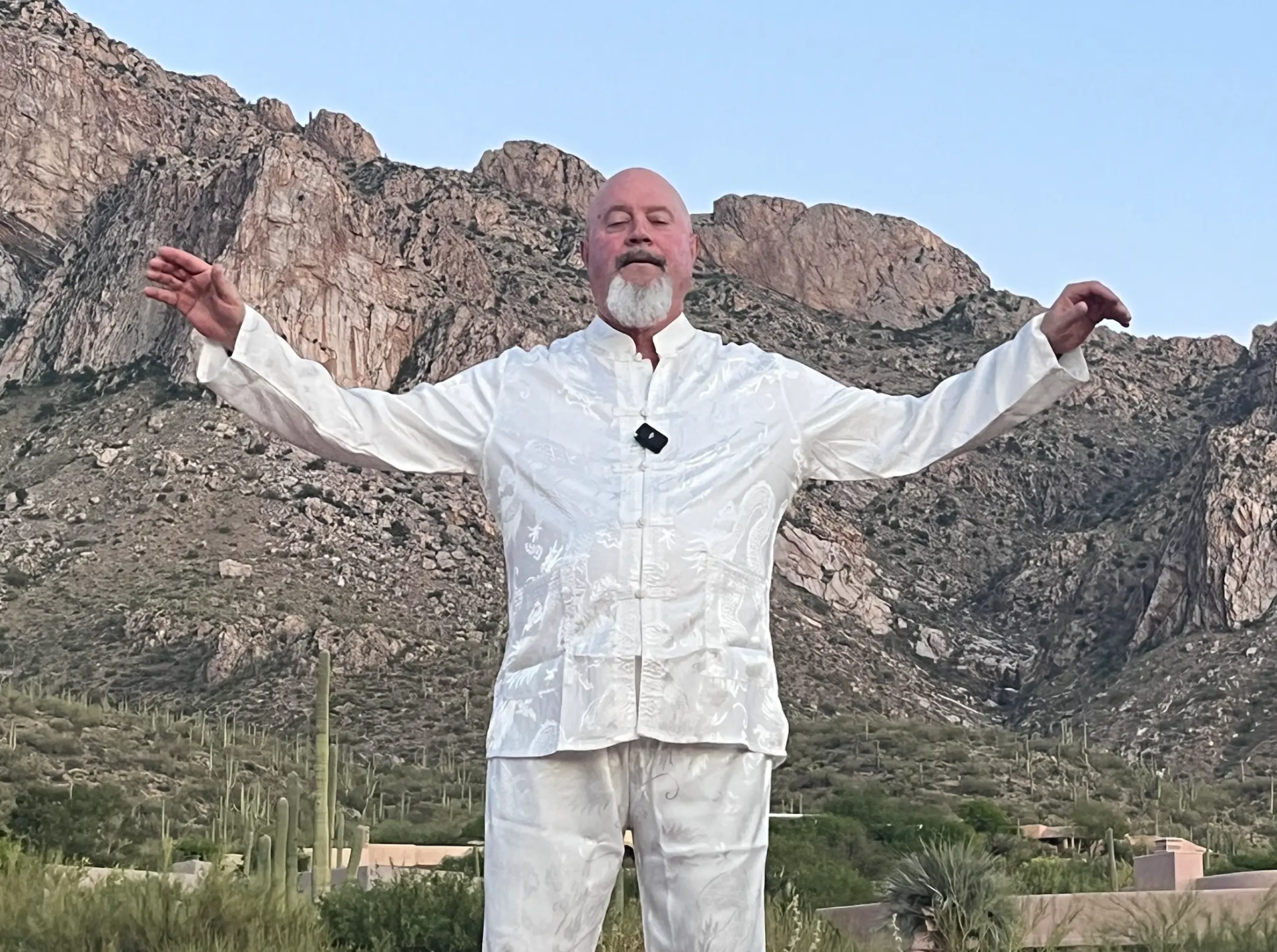 Master Lama Rasaji leads a Tai Chi Gung class on the beach
