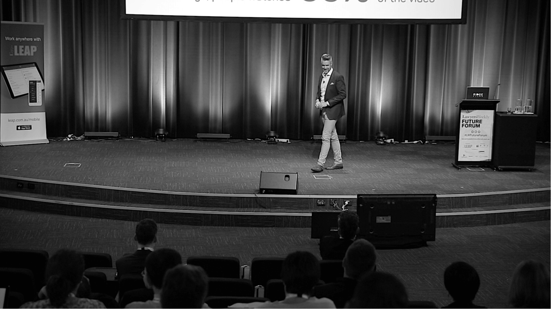 Chris Schwager on stage speaking to an audience at the Lawyers Weekly Future Forum