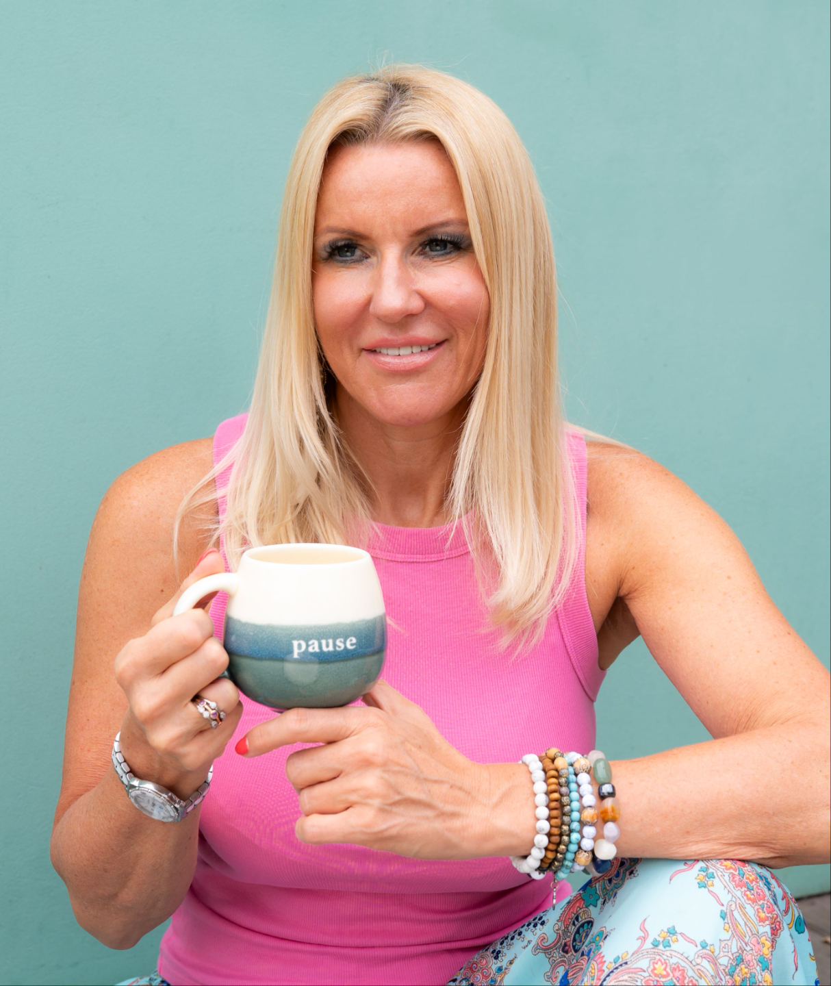 Adele-Marie Hartshorn somatic coach for women holding pause mug