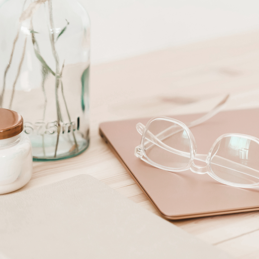 Glasses on tablet on desk