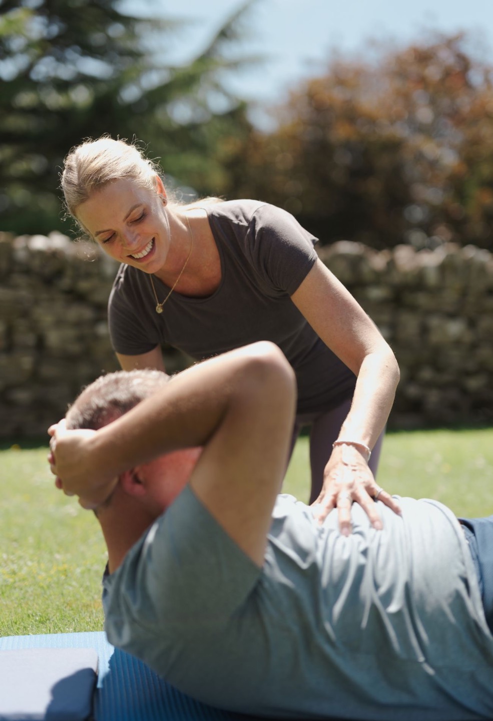 Kari Sherman providing personalised Pilates coaching and technique guidance to client Jeff.