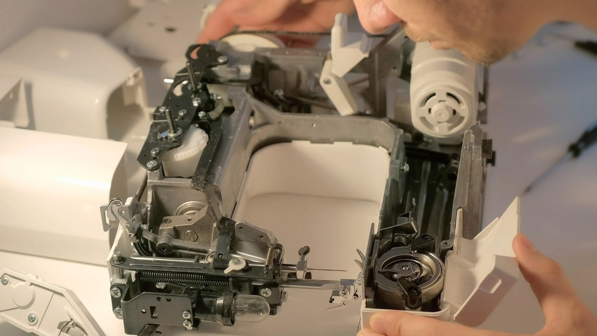 Sewing Doc Academy teaches you how to safely remove the plastic covers from a sewing machine