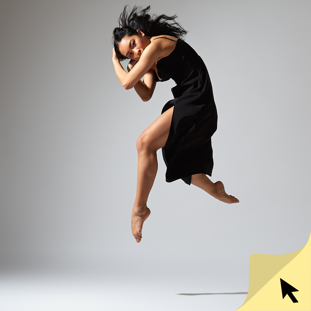 A woman captured mid-air in a dynamic jump, with vibrant splashes of paint exploding behind her.