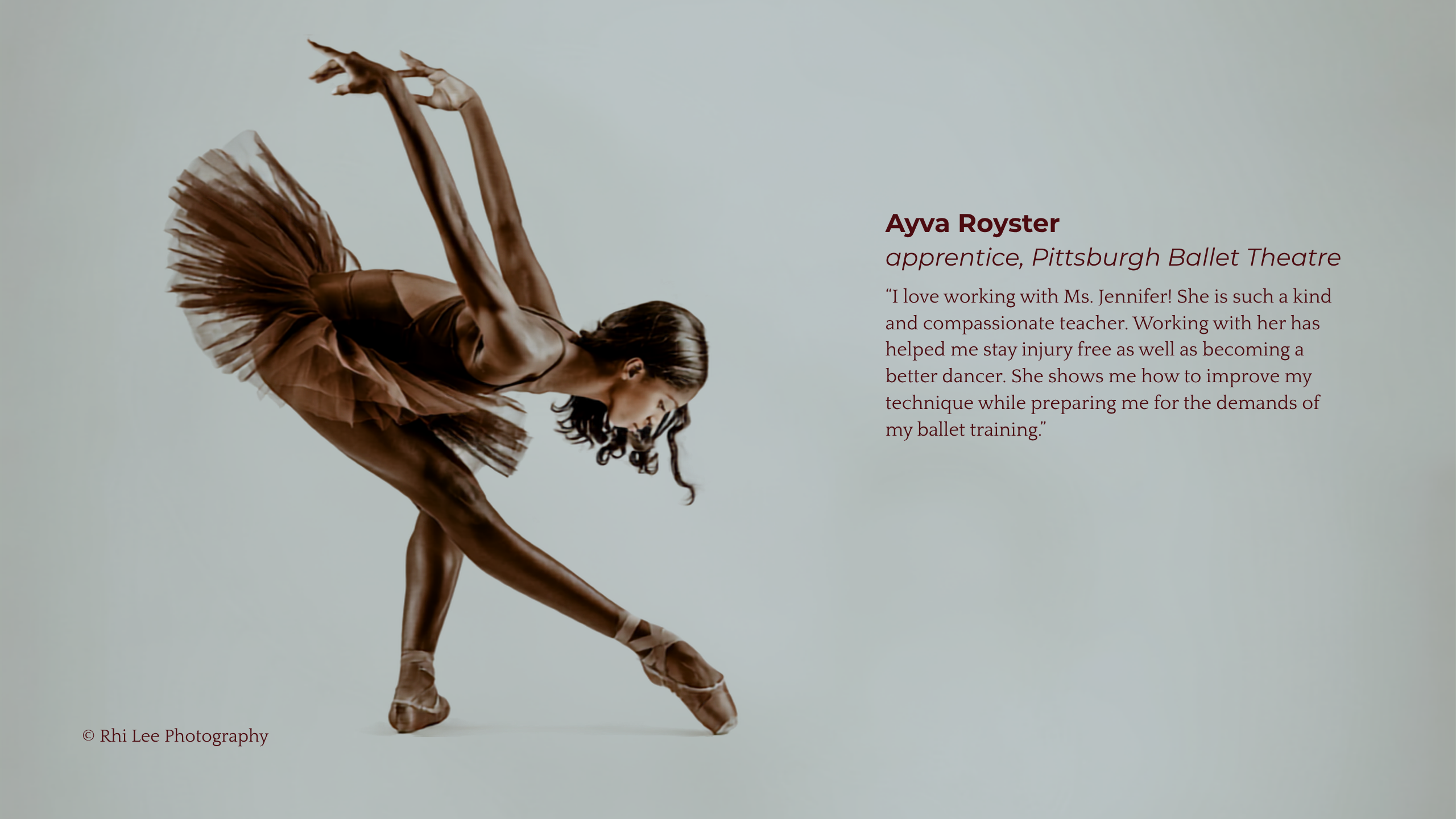 A ballerina in a tutu gracefully executing a Vaganova Third Port de Bra.