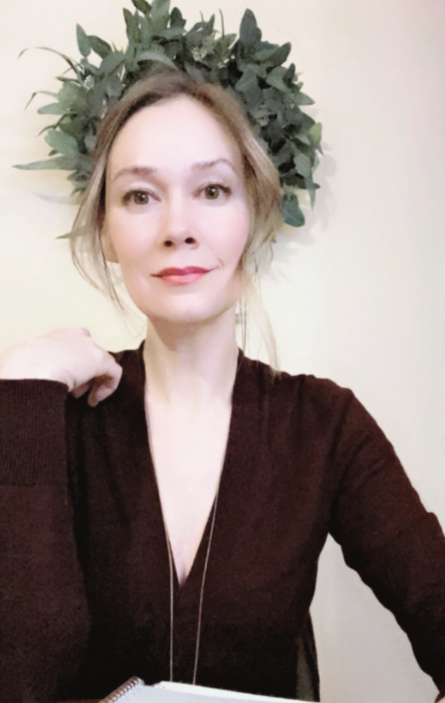 Somatic writing coach [Your Name] sitting with a notebook, offering a warm and grounded invitation to join the writing cohort