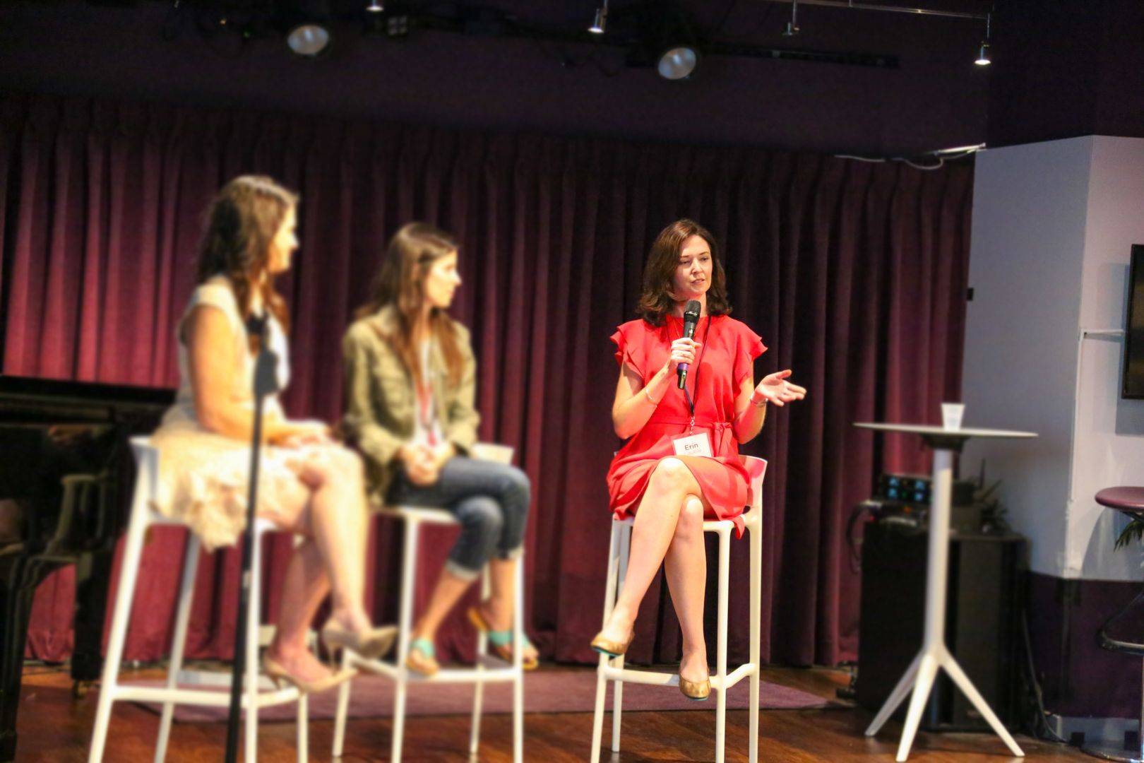 Erin Pelicano Cauble speaking onstage at a live founder event