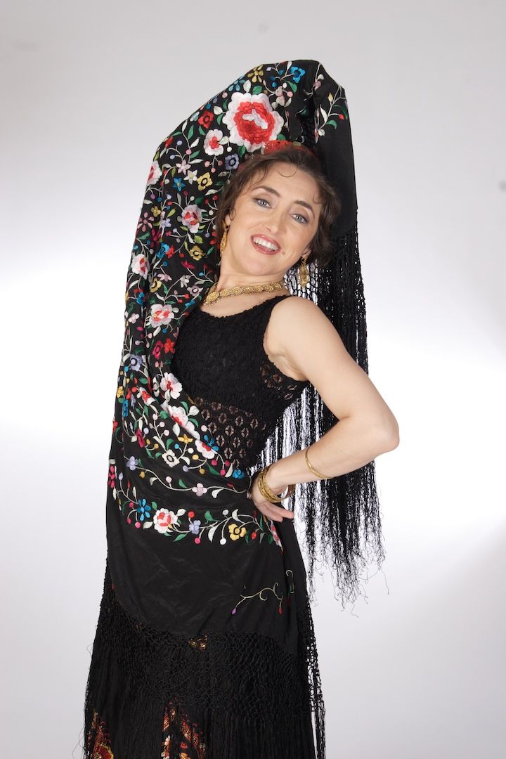 Dynamic image of a dancer performing a signature Lunaris Flamenco Power Pose™ with elegant posture and focused expression, designed to boost self-esteem and inner strength