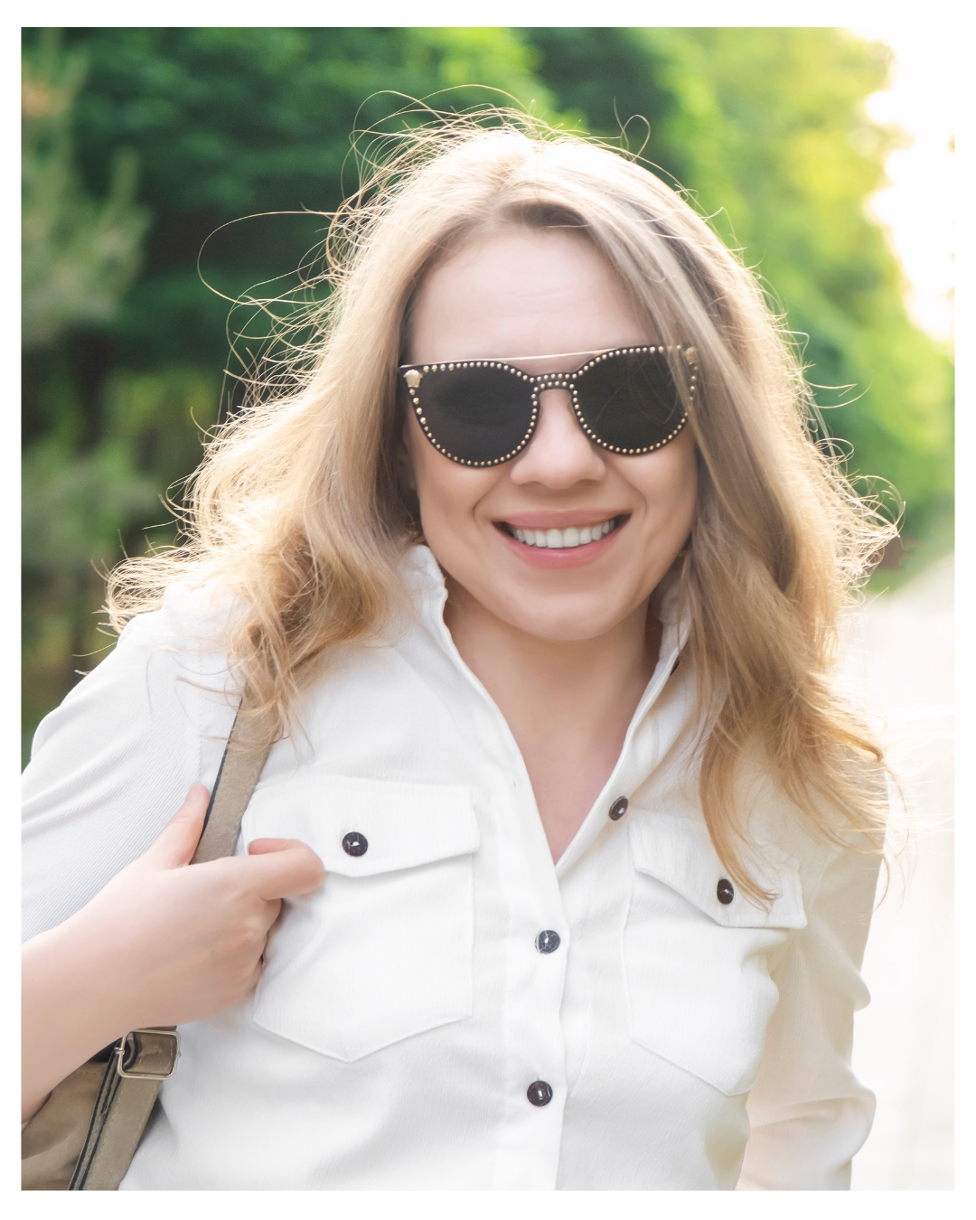 A woman in her 40s smiling and walking along a peaceful path, representing the 4-step clinical journey of a Relational EMDR Intensive in Vermont, NH, NC, and SC.