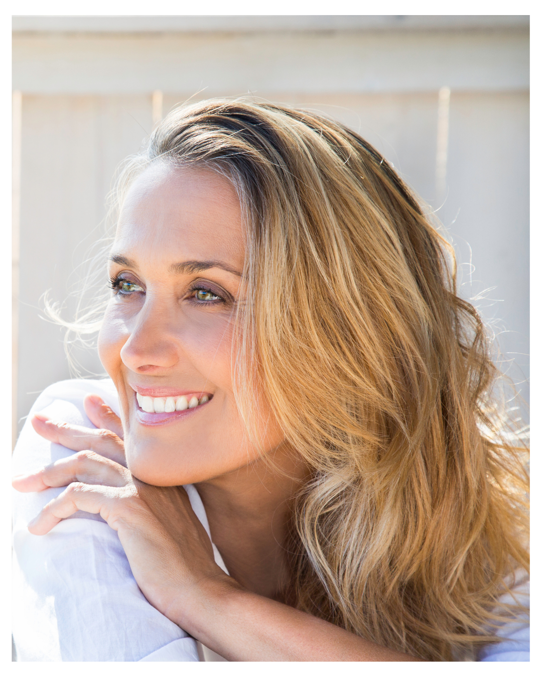 A woman smiling happily and experiencing emotional relief after a Relational EMDR Intensive for trauma and burnout in Vermont and the Carolinas.