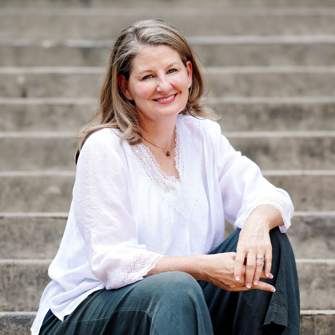 Samantha Bray LCSW OCD specialist sitting on steps