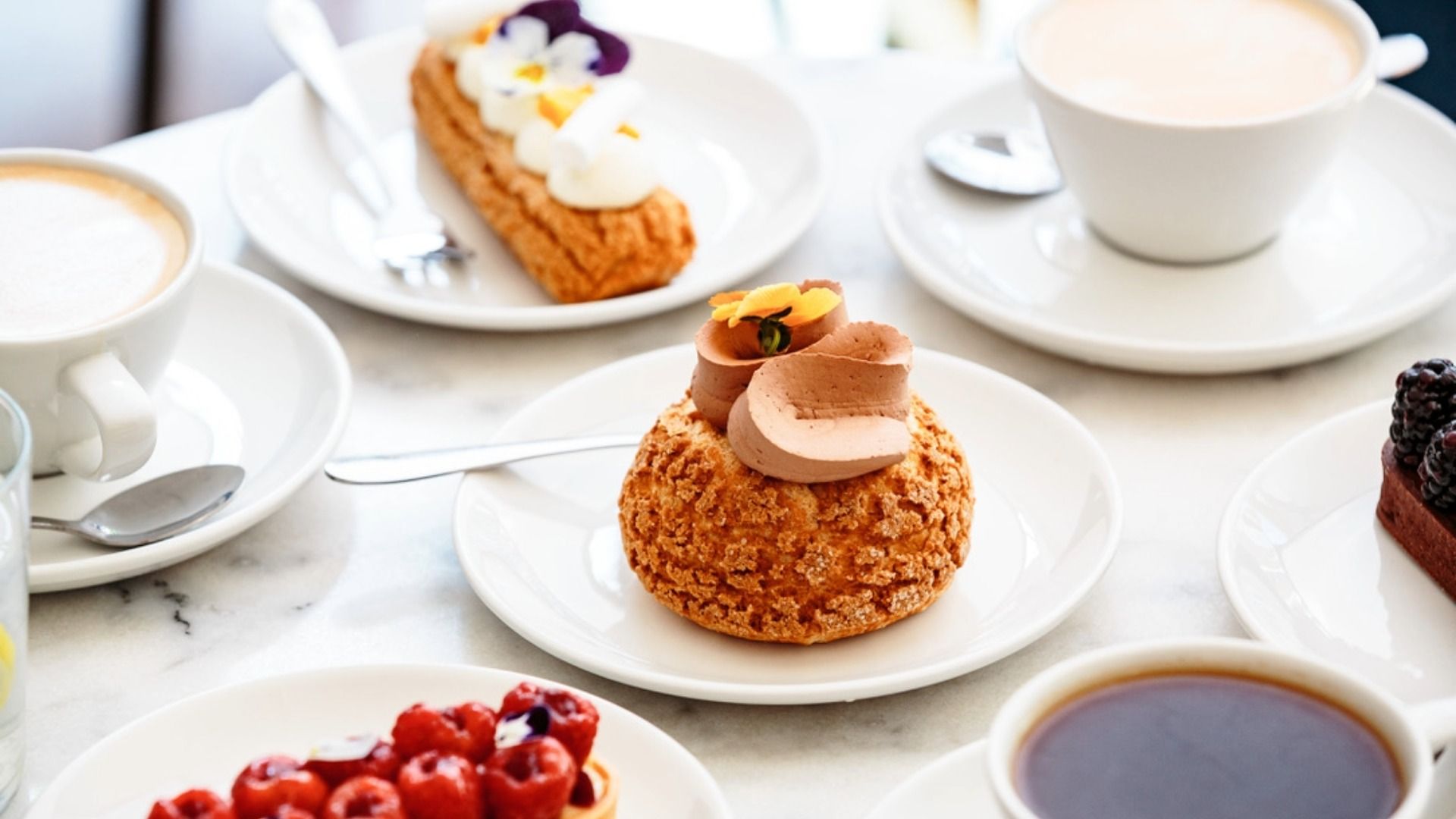 Professionally plated patisserie dessert presented in a restaurant setting, demonstrating restrained dessert presentation and proportion.