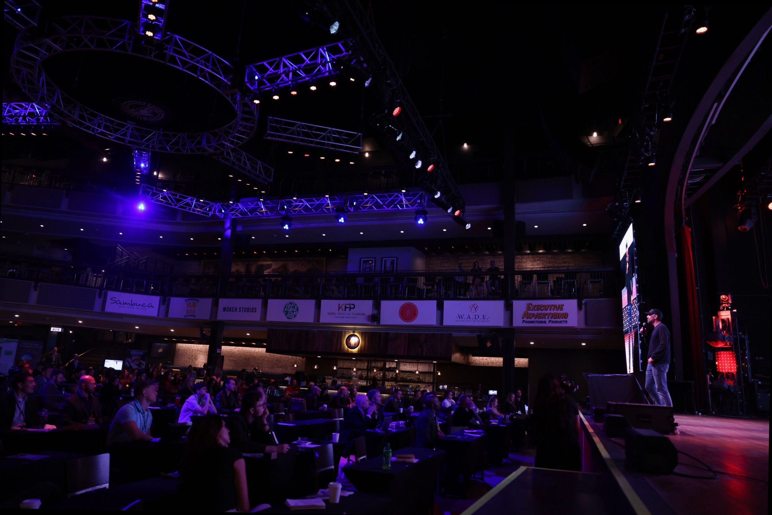 Jamie Miller speaking live on stage demonstrating Conscious Communication