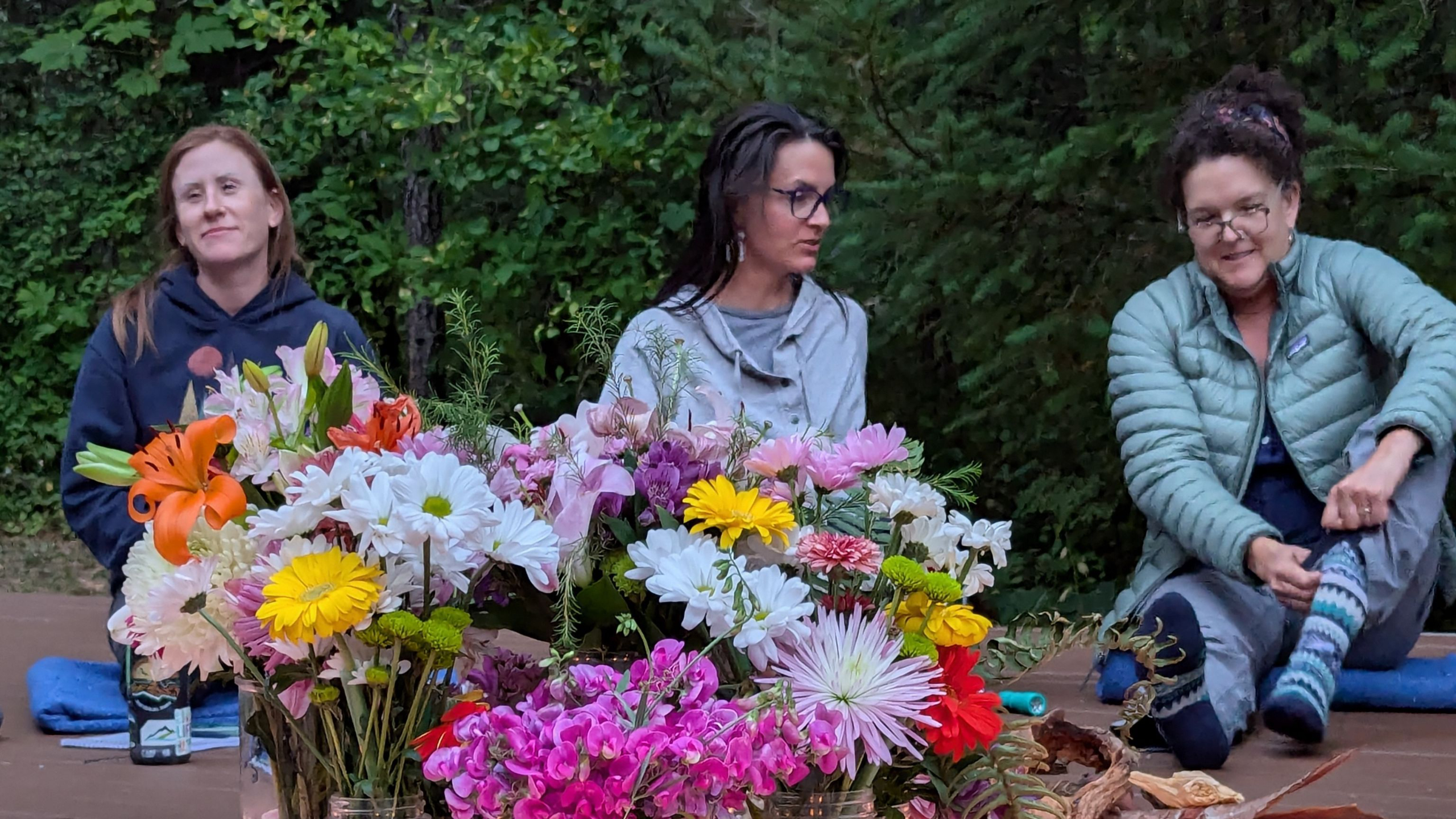 Candid women sitting in circle at Tipi Village Retreat in Oregon