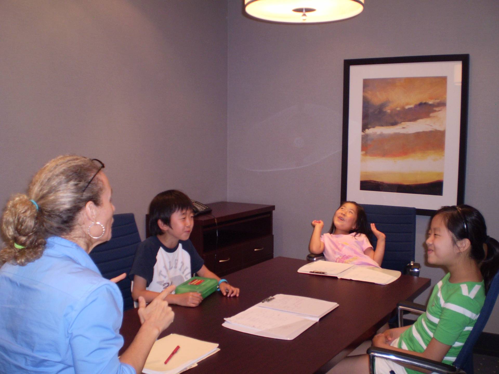 Sandra teaching a small group of Korean children