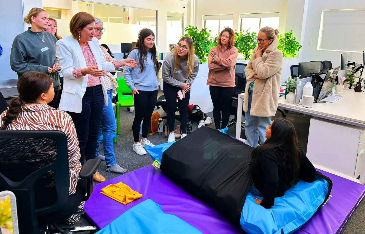 Kerry Evetts Owner of SenseUp presenting Workshop content to a group of workshop attendees in a Practice Setting.