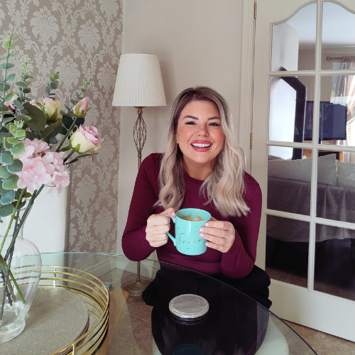 Woman smiling confidently, radiating self-worth and empowerment, embodying calm, clarity, and magnetic feminine leadership