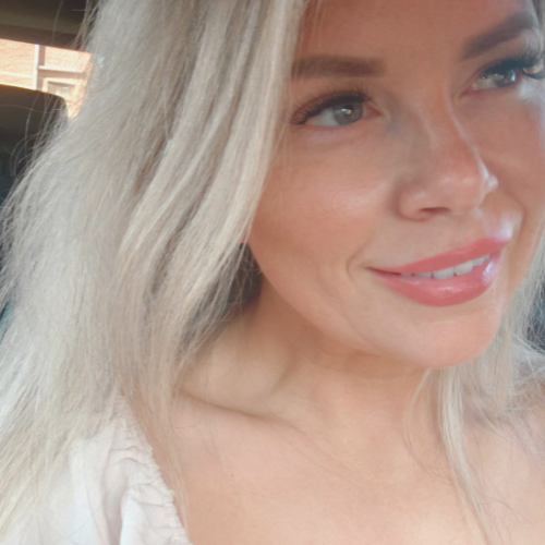 Female self-worth coach sharing her story of healing and empowerment