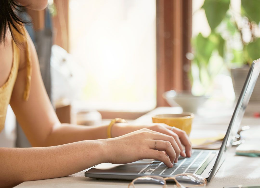 woman typing on computer