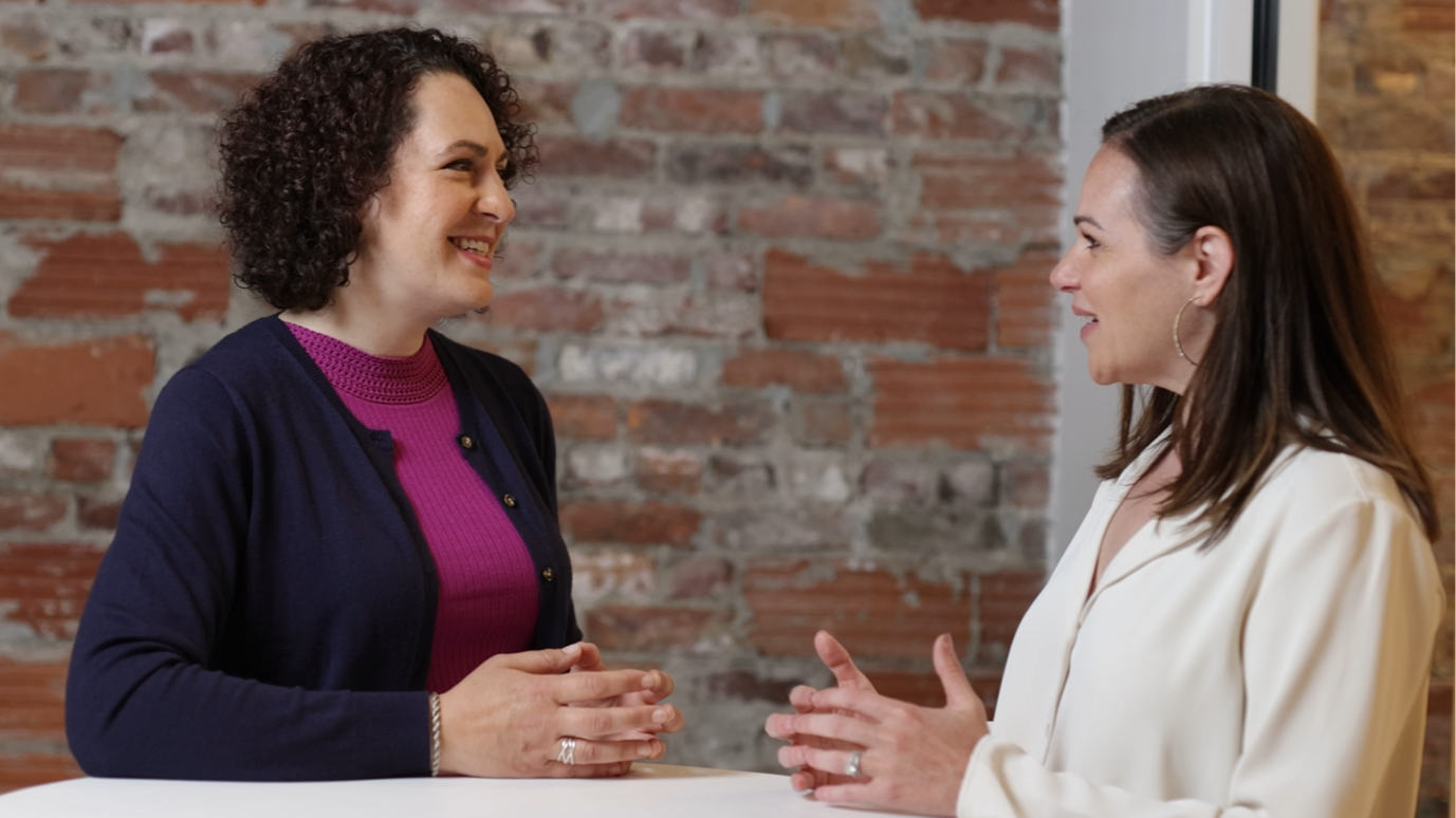 Executive coach Erica Mattison speaking with a professional client