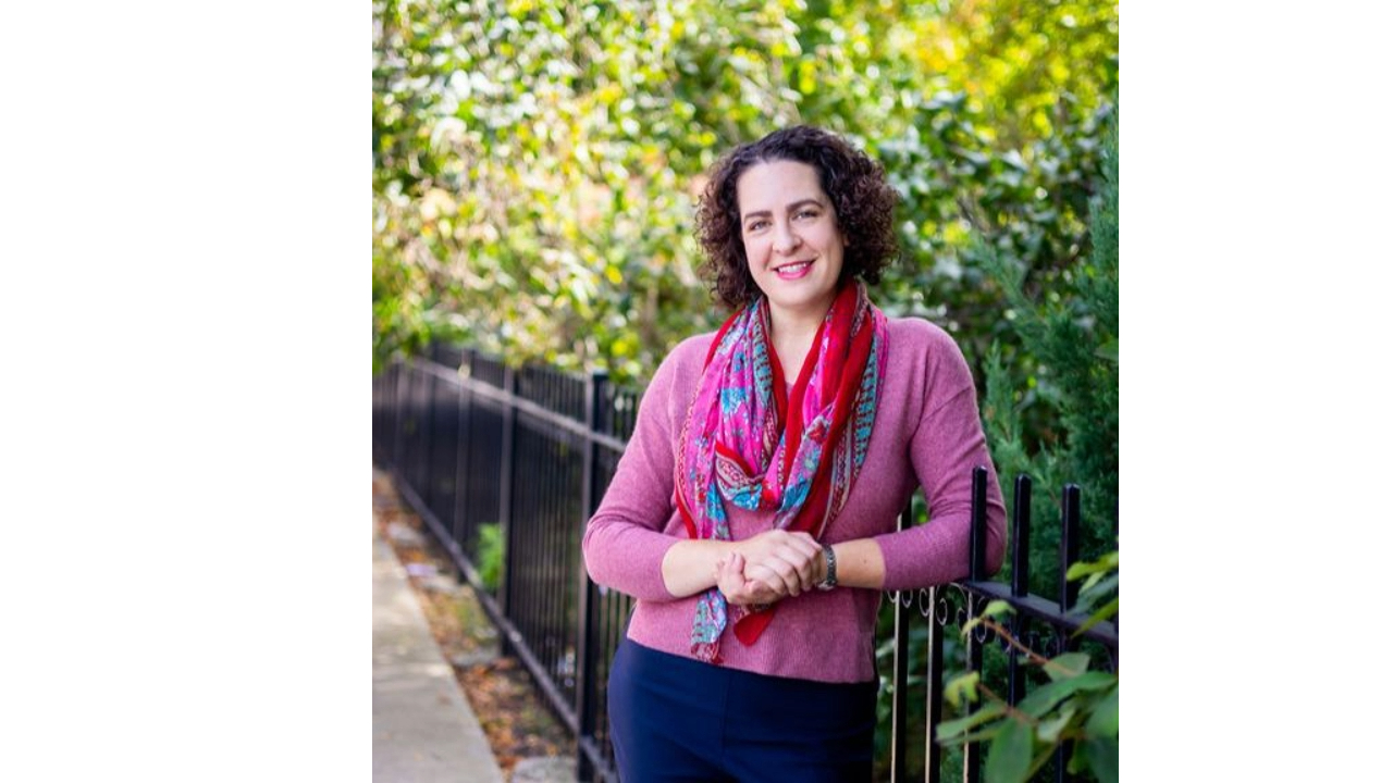 Erica Mattison standing outside surrounded by greenery