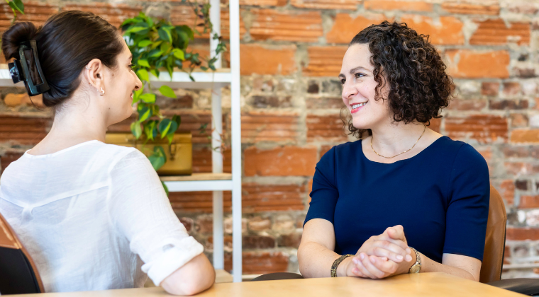 Erica meeting with a mid-career professional