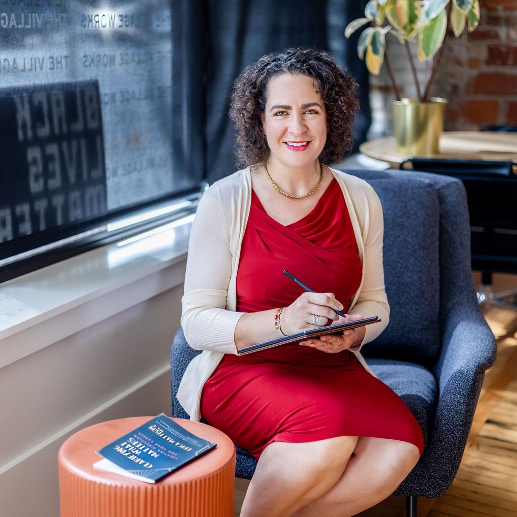 Career Clarity Coach Erica Mattison writes in a journal