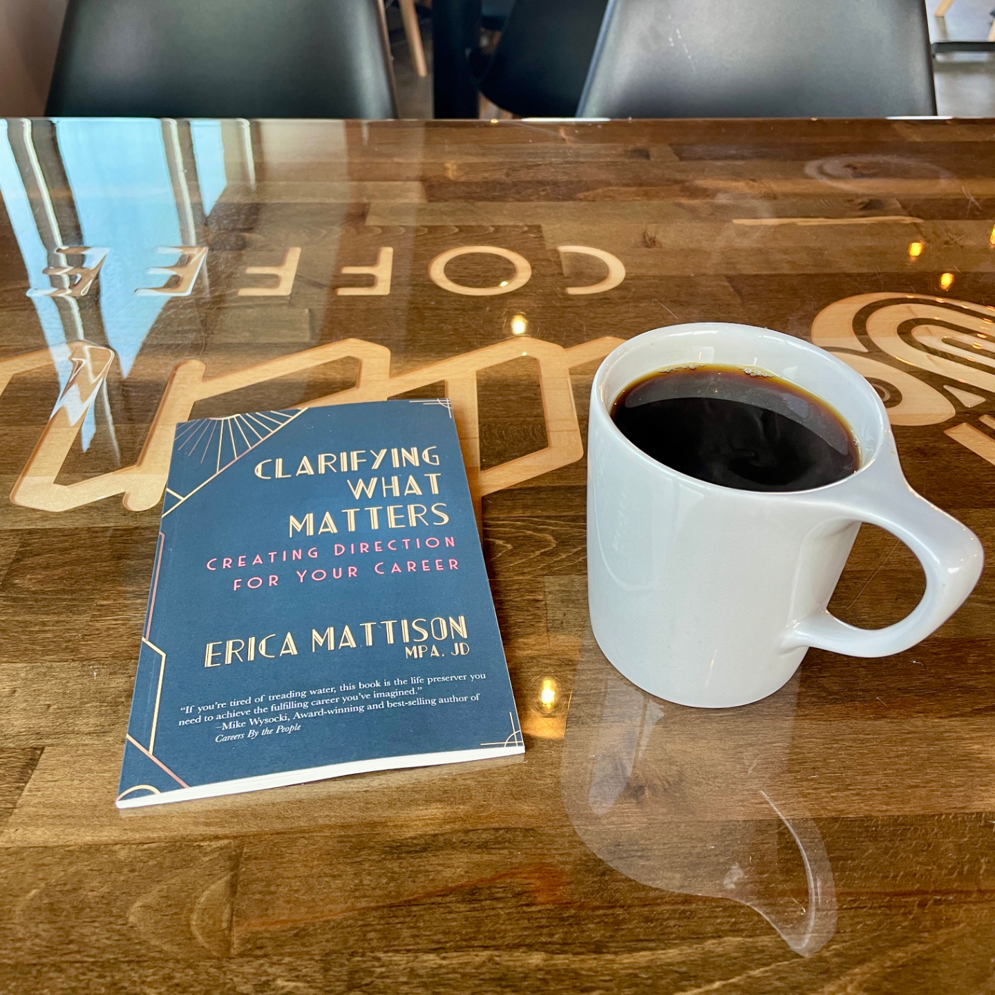 Clarifying What Matters career book on a table in a cafe with a cup of coffee