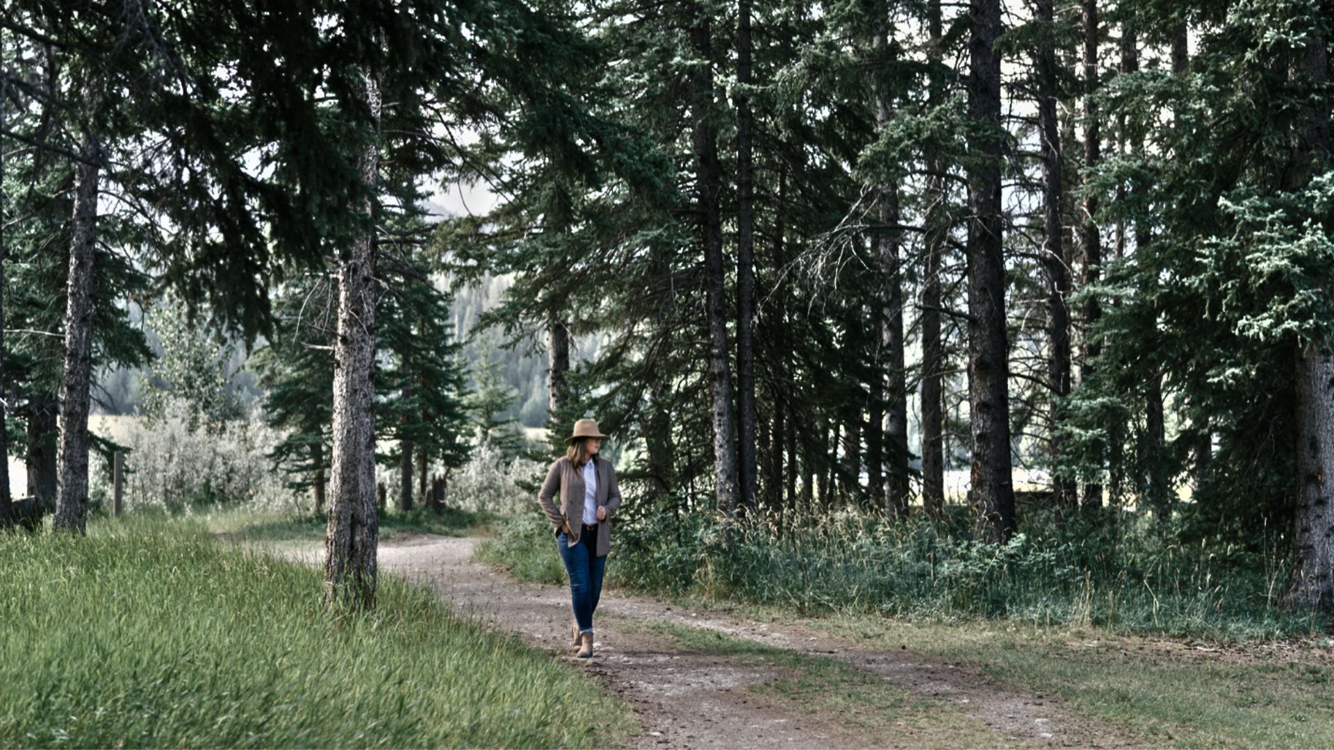 Healer walking in nature surrounded my trees