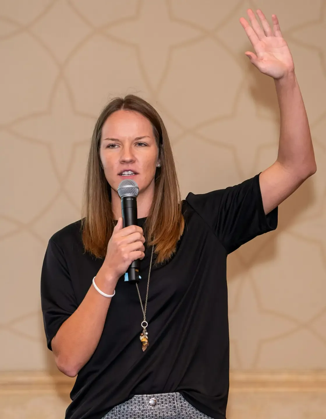 Dr. Ashley Kuchar speaking at an event