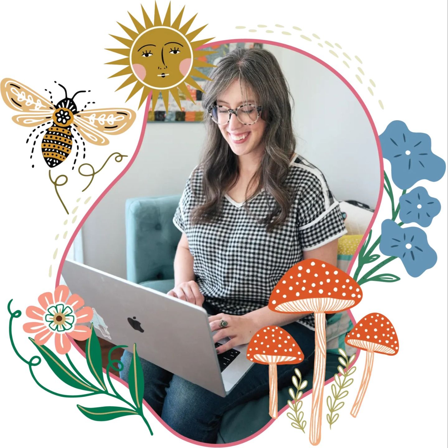 Stacie Bloomfield working at her laptop surrounded by Gingiber illustrations