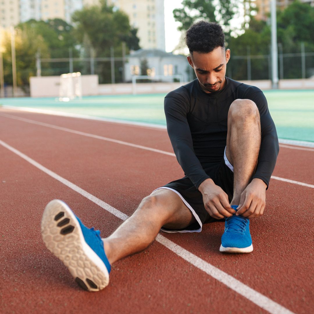 Person standing on mountain with dog taking in an incredible view