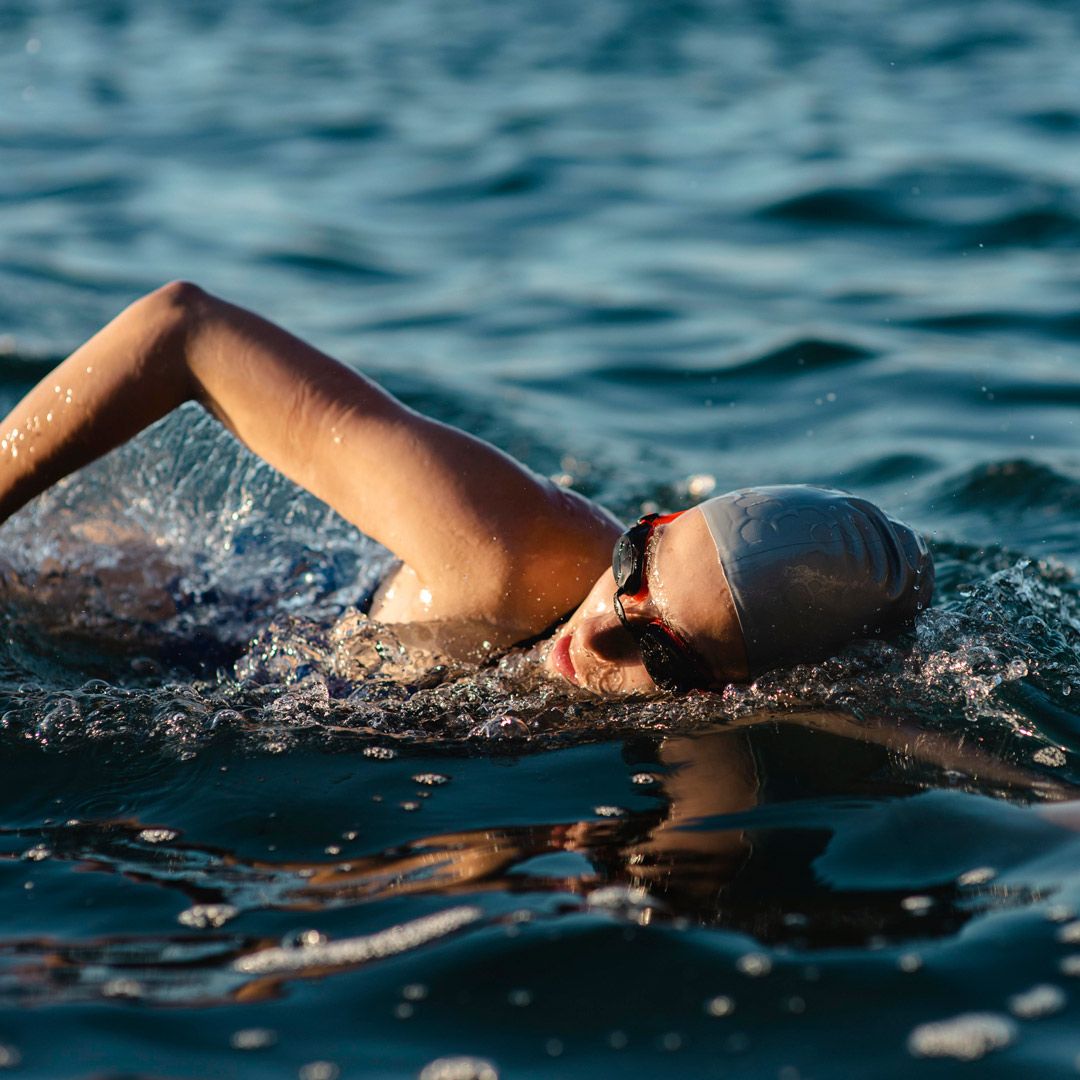 Person standing on mountain with dog taking in an incredible view