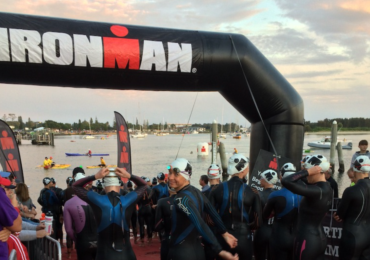 Person standing on mountain with dog taking in an incredible view