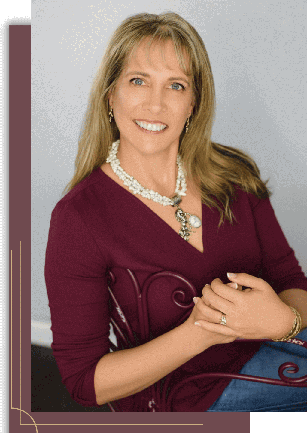 Rebecca in a burgundy chair