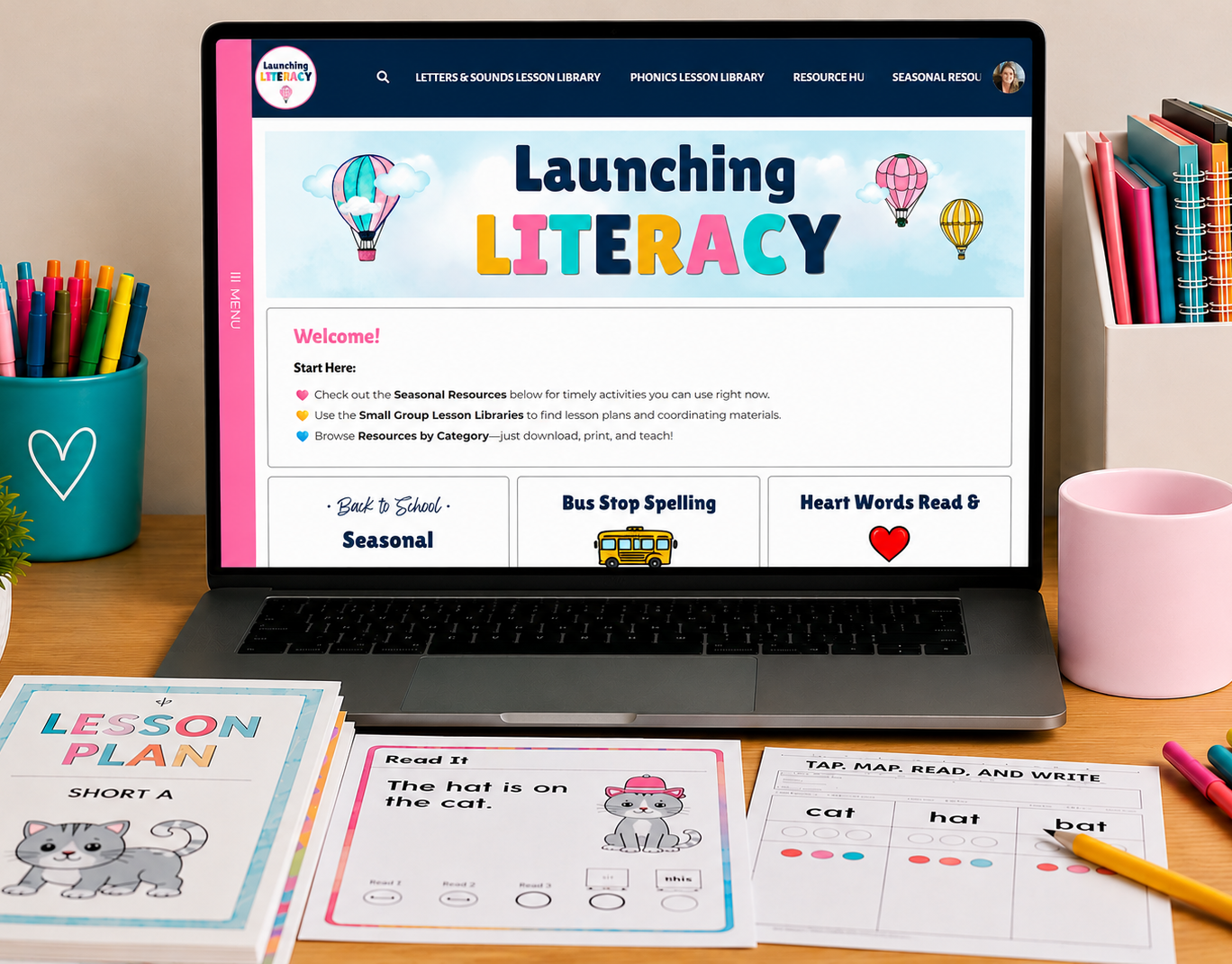 image of open laptop with launching literacy membership homepage