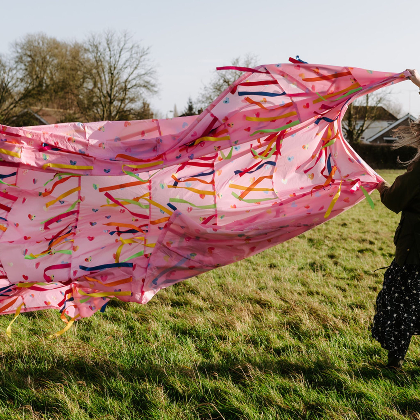 Elizabeth James holding an Ocean Sensory Parachute