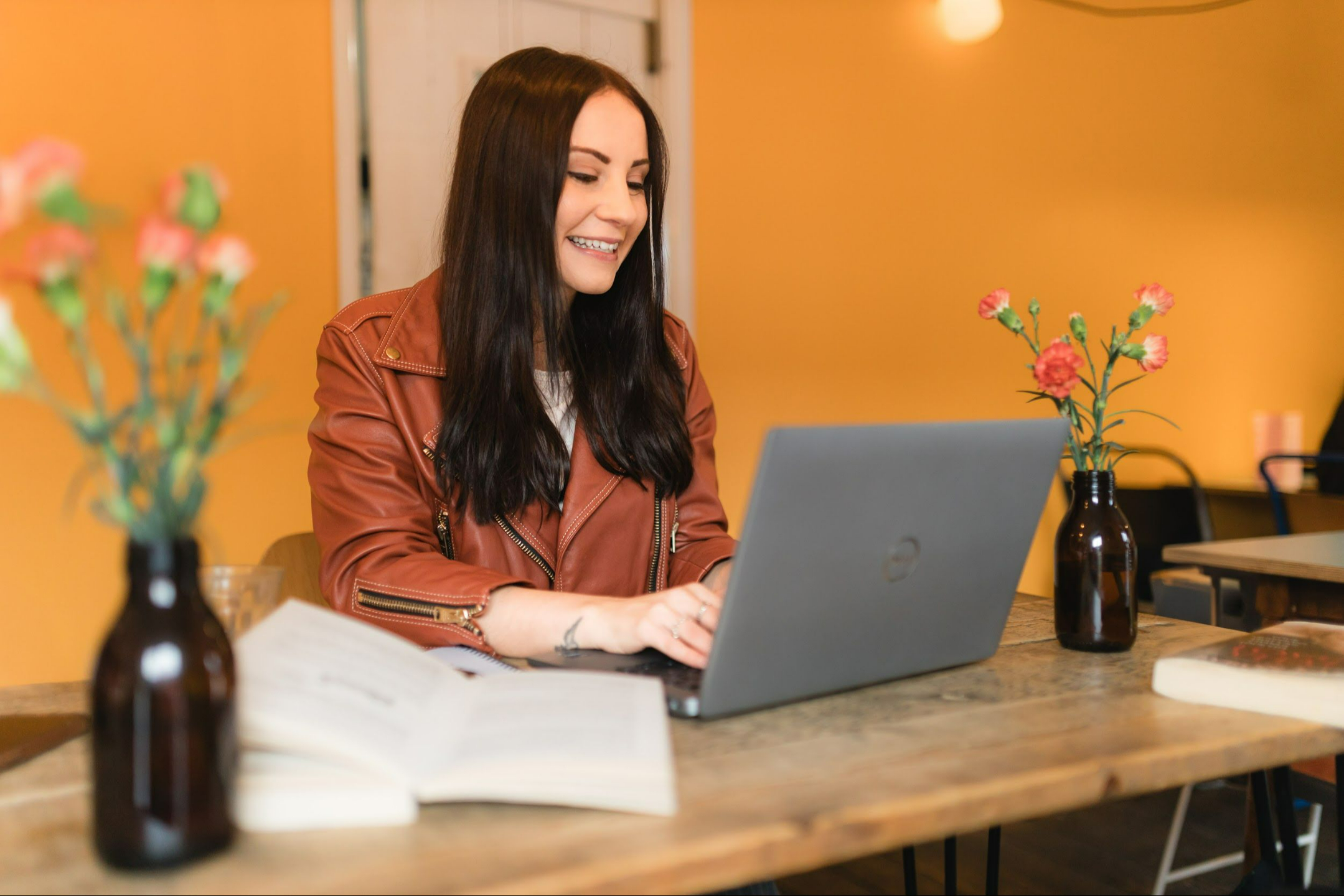 A women on a couch using a laptop