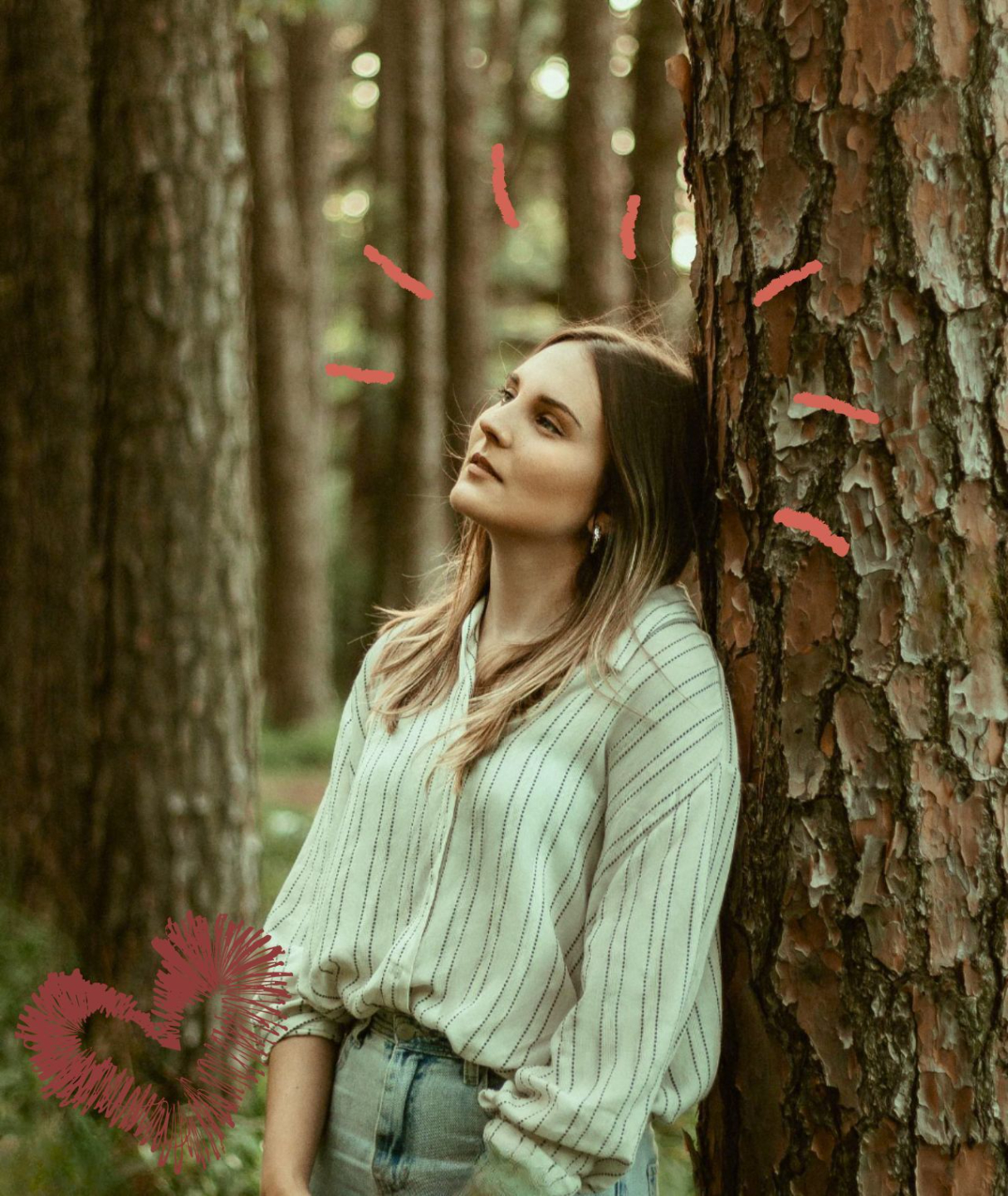Someone wirting in a notebook while also look at another book. A laptop and coffee mug are on their table.