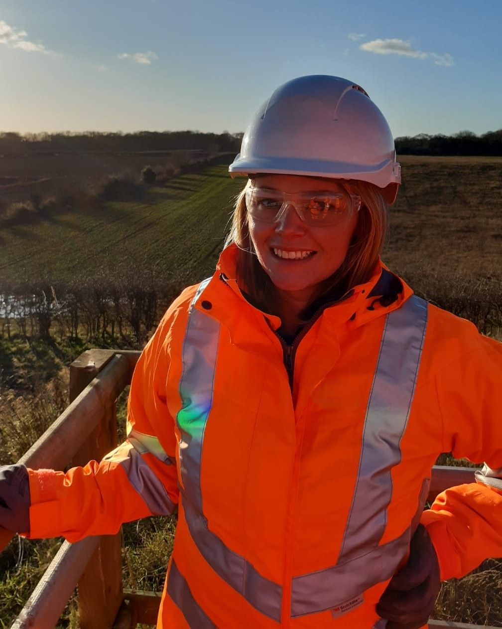 Emma wearing PPE on site during a community engagement visit