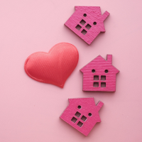 Three houses with heart icon